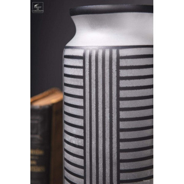 Black lines on a white frosted vase